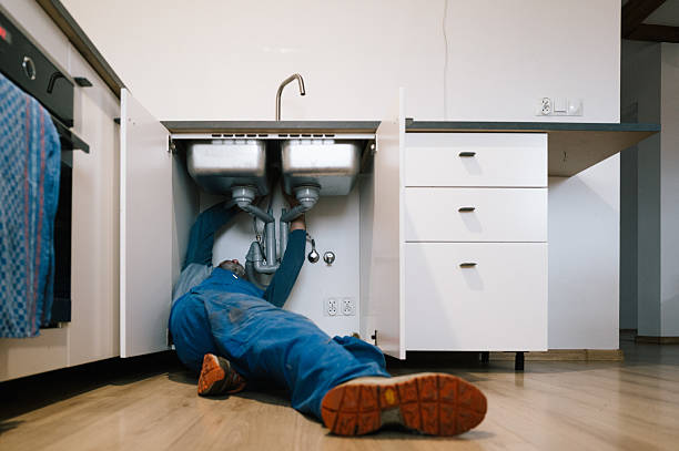 Professional Emergency Plumber technician working in Kalkaska, MI